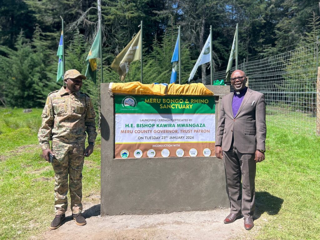John Kinoti joins a religious leader in marking the launch of the Bongo Sanctuary